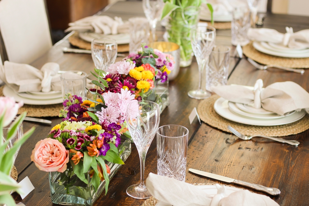 Spring Tablescape set for Easter Dinner with bunnies, pottery barn napkins and RH table and chairs.